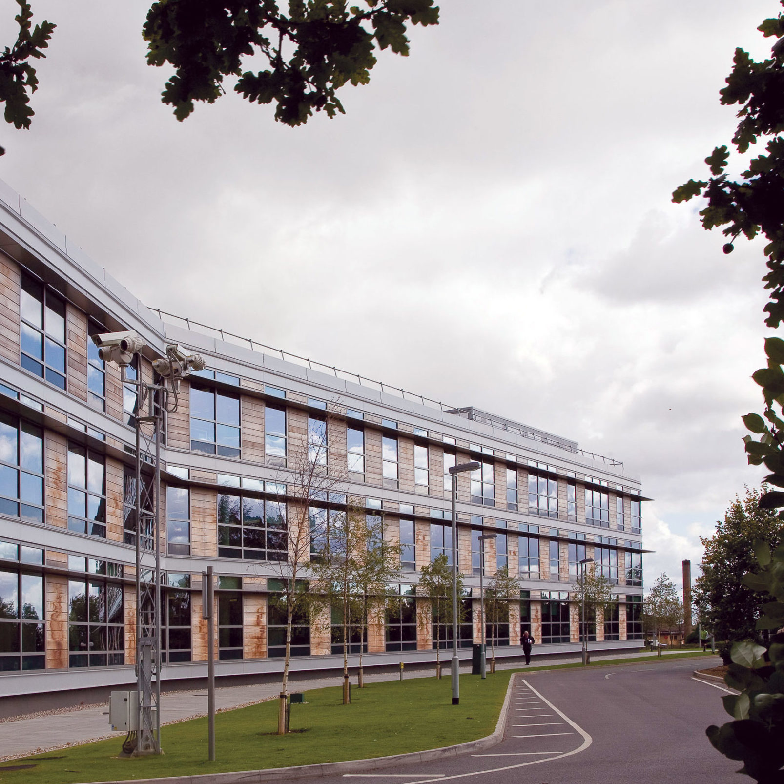 Exterior of one of our buildings at Hanslope Park. Modern offices with large glass windows.